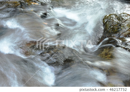 water falling on river pass rock and stone water falling on river pass rock and stone 46217732
