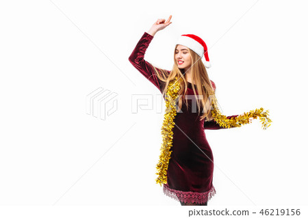 Happy woman in santa hat and dress Happy woman in santa hat and dress 46219156