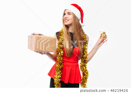Happy woman wearing a Santa hat, new year Happy woman wearing a Santa hat, new year 46219428