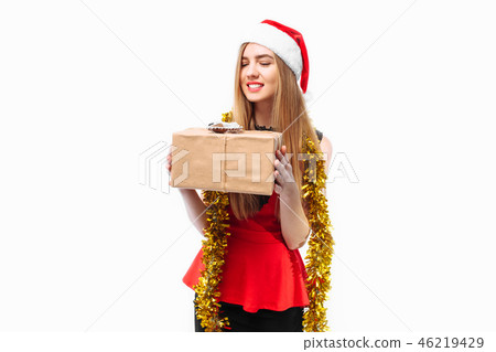 Happy young woman in santa hat and dress Happy young woman in santa hat and dress 46219429