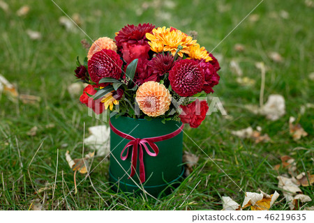 Flower arrangement in a box, a pot with pink, red, orange, marsala for a girl as a gift with roses Flower arrangement in a box, a pot with pink, red, orange, marsala for a girl as a gift with roses 46219635