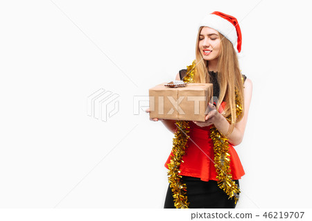 Happy young woman in santa hat and dress Happy young woman in santa hat and dress 46219707