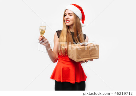 Happy woman wearing a Santa hat Happy woman wearing a Santa hat 46219712