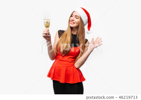 Happy woman in santa hat and dress 46219713