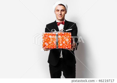 Elegant guy in the hat of Santa Claus Elegant guy in the hat of Santa Claus 46219717