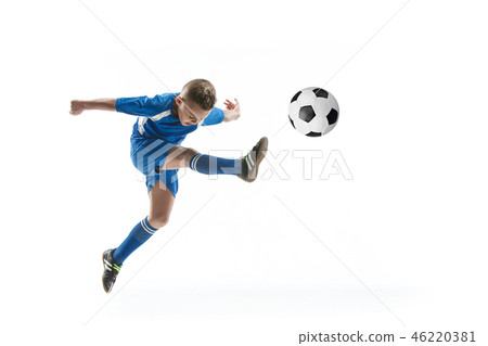 Young boy with soccer ball doing flying kick 46220381