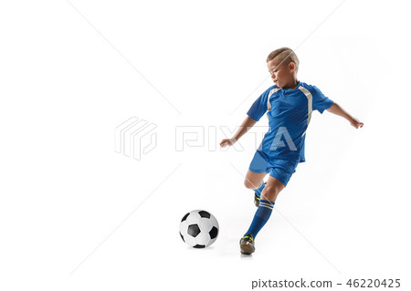 Young boy with soccer ball doing flying kick 46220425