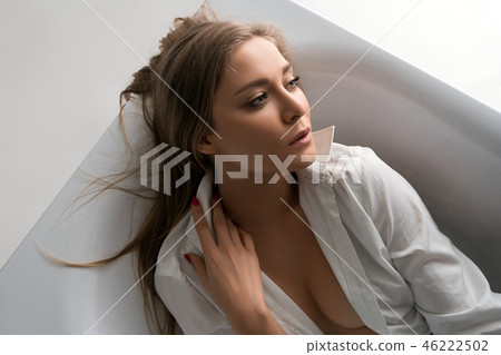 Beautiful blonde in the bath high angle view Beautiful blonde in the bath high angle view 46222502