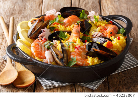 Homemade freshly prepared paella with king prawns Homemade freshly prepared paella with king prawns 46222807
