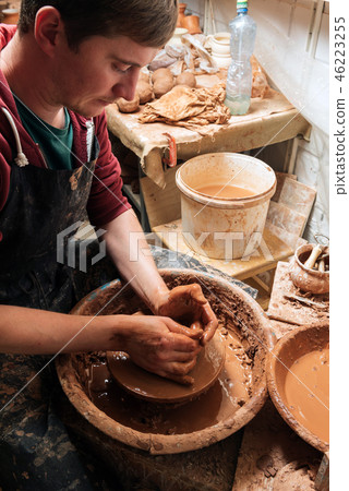 Potter at work. Workshop place. 46223255