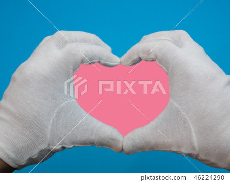 pink heart symbol made of hand gesture pink heart symbol made of hand gesture 46224290
