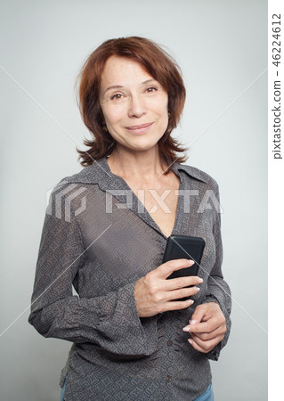 Happy mature business woman with cell phone Happy mature business woman with cell phone 46224612