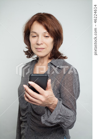 Mature woman with mobile cell phone 46224614