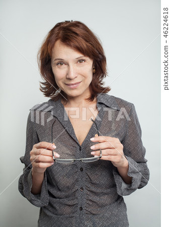 Cheerful mature woman with glasses. Cheerful mature woman with glasses. 46224618