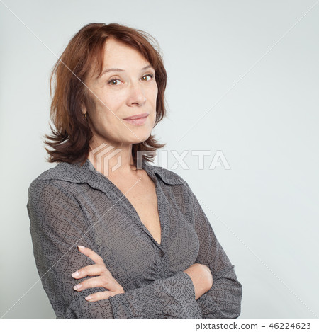 Friendly business woman with crossed arms. Friendly business woman with crossed arms. 46224623