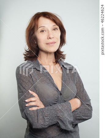 Mature woman with crossed arms, portrait Mature woman with crossed arms, portrait 46224624