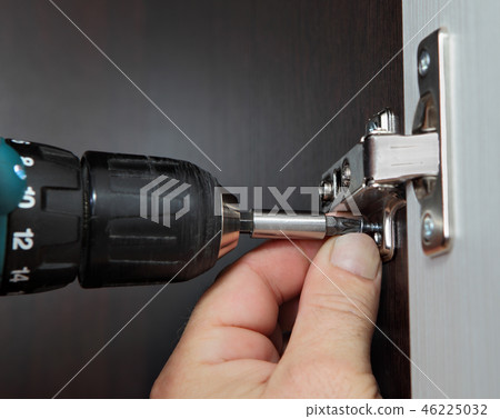 Cordless drill with fastener bit close-up. Cordless drill with fastener bit close-up. 46225032