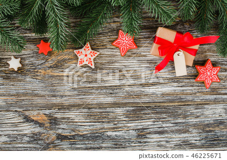 Christmas background with fir tree, gingerbread and gift. Christmas background with fir tree, gingerbread and gift. 46225671