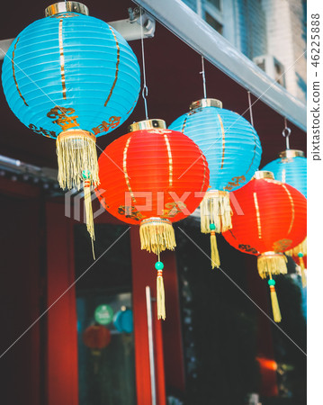 Chinese Paper Lanterns Sway on Wind on the Roof of a Building by Day on the Street 46225888