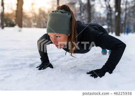 Female athlete exercising in park in winter 46225938