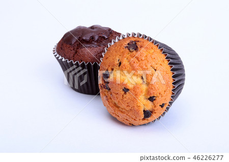 Assorted with Delicious homemade muffin, cupcake with raisins, nuts and chocolate isolated on white 46226277
