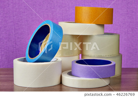 Heap of multicolor and adhesive tape rolls 46226769