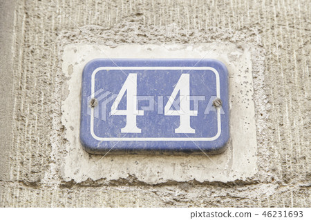 Number forty-four on the wall of a house Number forty-four on the wall of a house 46231693