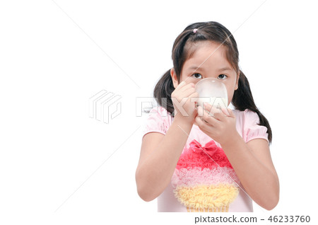 Cute asian girl drinking fresh milk isolated Cute asian girl drinking fresh milk isolated 46233760
