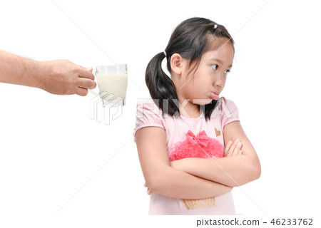 Sad girl refuses drink a fresh milk isolated Sad girl refuses drink a fresh milk isolated 46233762