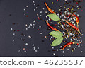 Spices on a black background. 46235537