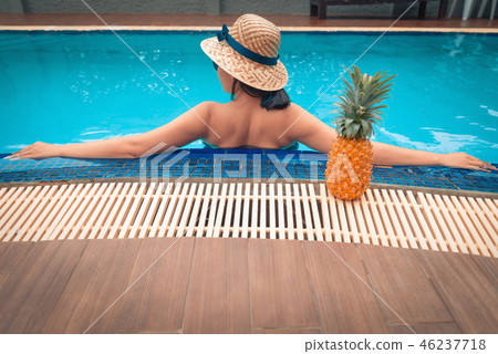 Portrait of asian woman relaxing in swimming pool Portrait of asian woman relaxing in swimming pool 46237718