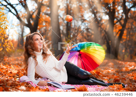 Girl in autumn forest 46239446