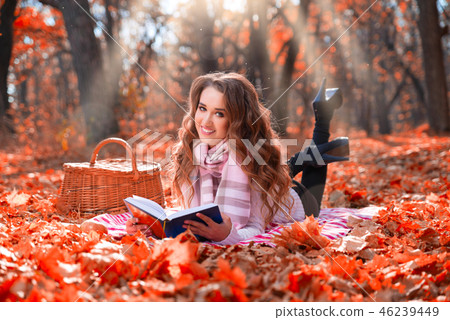 Girl in autumn forest 46239449