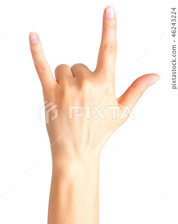 Female hand showing rock n roll sign or giving the devil horns gesture Female hand showing rock n roll sign or giving the devil horns gesture 46243224