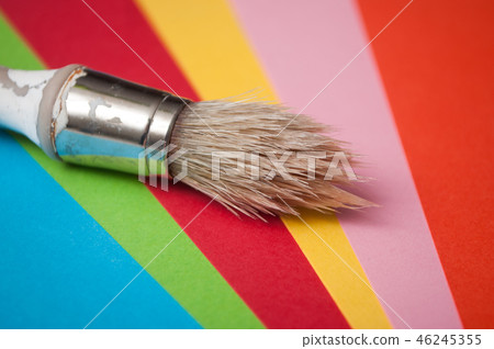 paint brush on colorful palette background 46245355