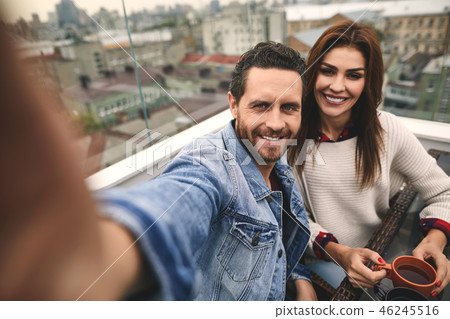 Smiling couple is locating on nice terrace 46245516