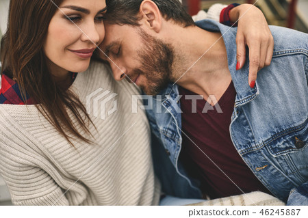 Couple in love is sitting together outdoor Couple in love is sitting together outdoor 46245887