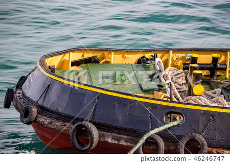 Colorful tugboat bow in Greek harbor, partial view 46246747