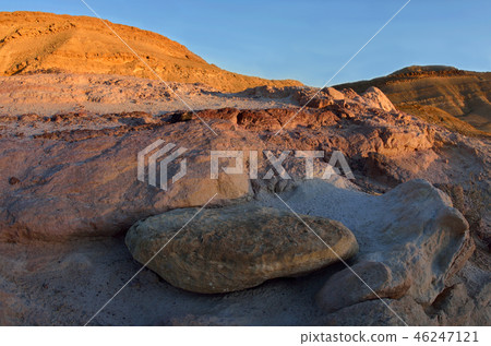 Sunset at colourful rocks and sand of Yeruham wadi 46247121
