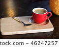 Red cup of coffee on wooden tray 46247257