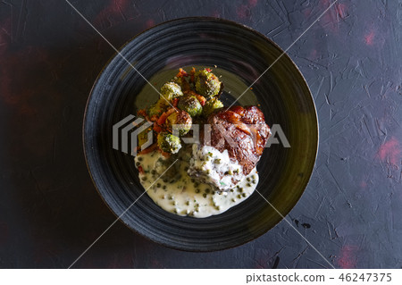 Beefsteak with Brussels sprouts and pea sauce Beefsteak with Brussels sprouts and pea sauce 46247375