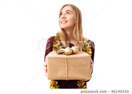 Pensive young woman, wearing a Santa Claus hat 46248350