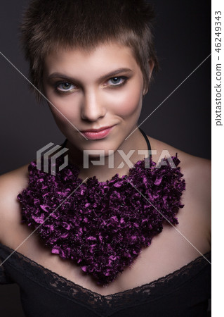 Portrait of a girl with a short haircut. 46249343