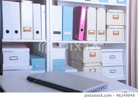 Modern office interior with laptop, chairs and bookcases Modern office interior with laptop, chairs and bookcases 46249949