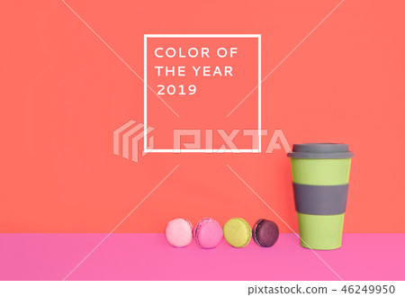 Cup of coffee to go with macarons on trendy background. Cup of coffee to go with macarons on trendy background. 46249950