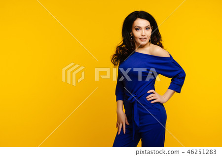 surprised woman in blue suit on yellow background surprised woman in blue suit on yellow background 46251283