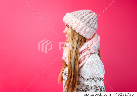 Beautiful girl standing isolated on red background 46251750