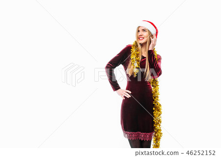 woman in santa hat and dress celebrating new year woman in santa hat and dress celebrating new year 46252152