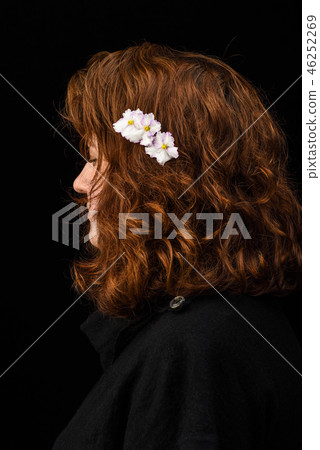 Portrait of a young girl with flowers 46252269