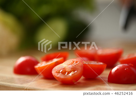 Cook holds knife in hand and cuts on Cook holds knife in hand and cuts on 46252416